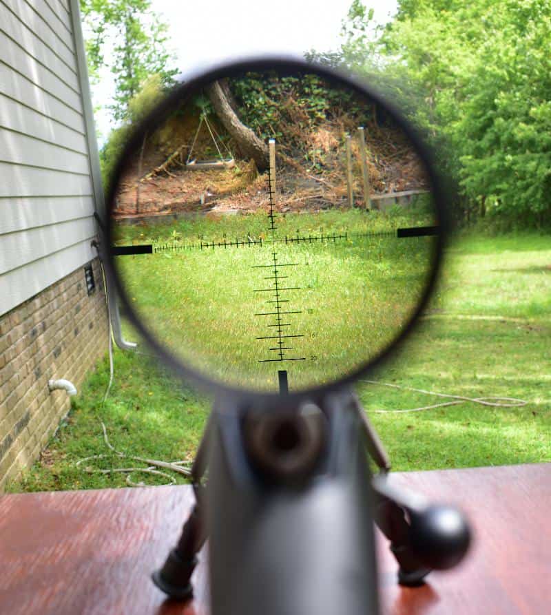 looking through a rifle scope